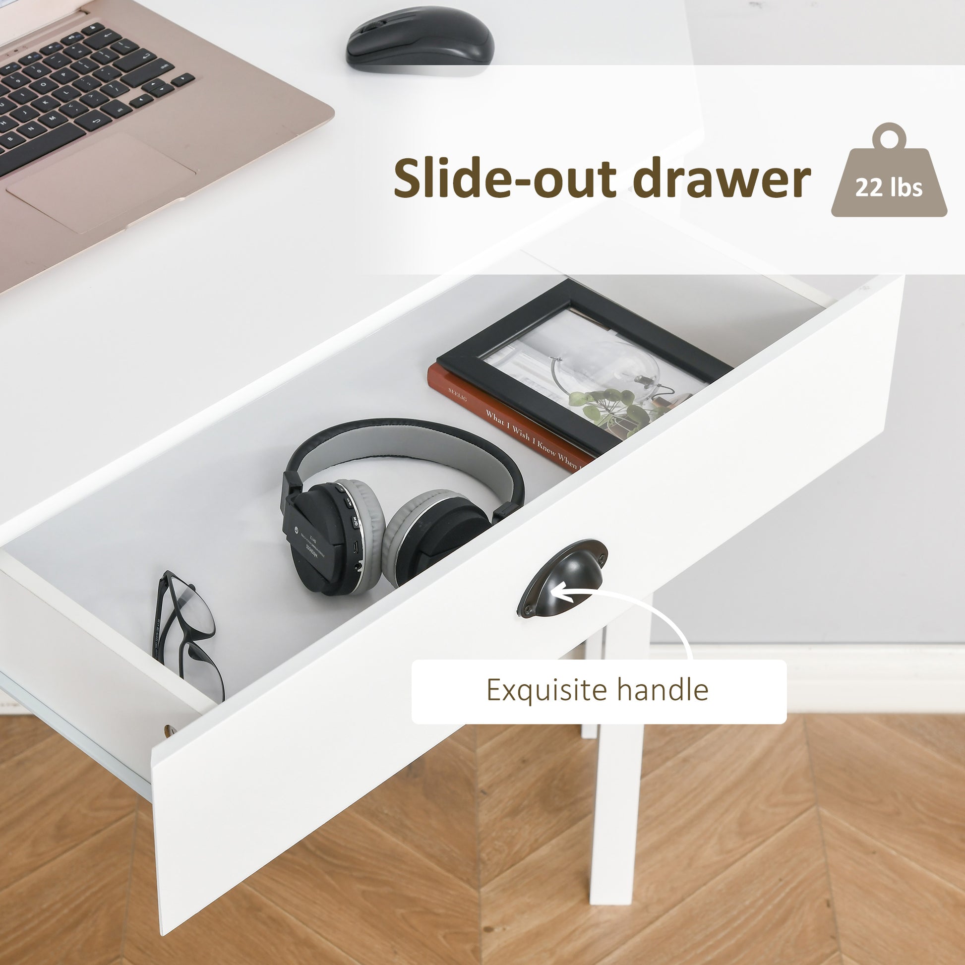 White desk slideout drawer with black headphones and glasses inside