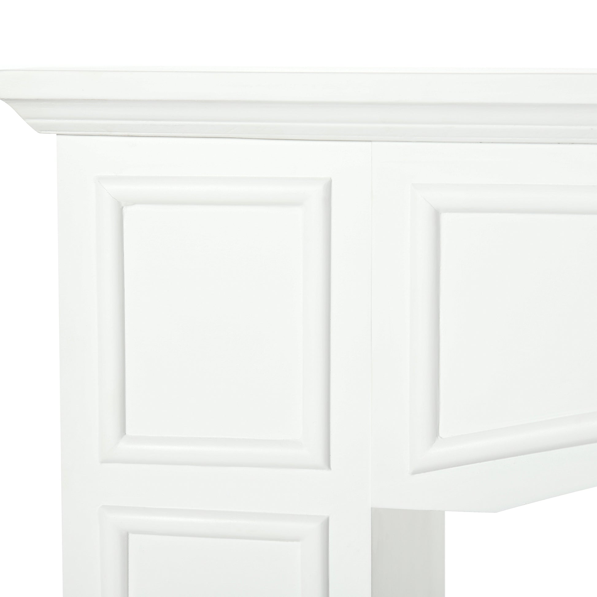 White wooden fireplace surround with raised panel detailing and decorative molding