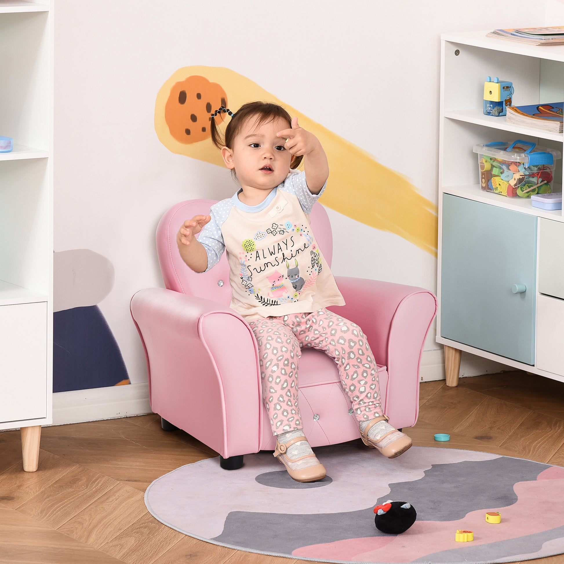 Pink childs armchair with faux leather upholstery and diamond tufting