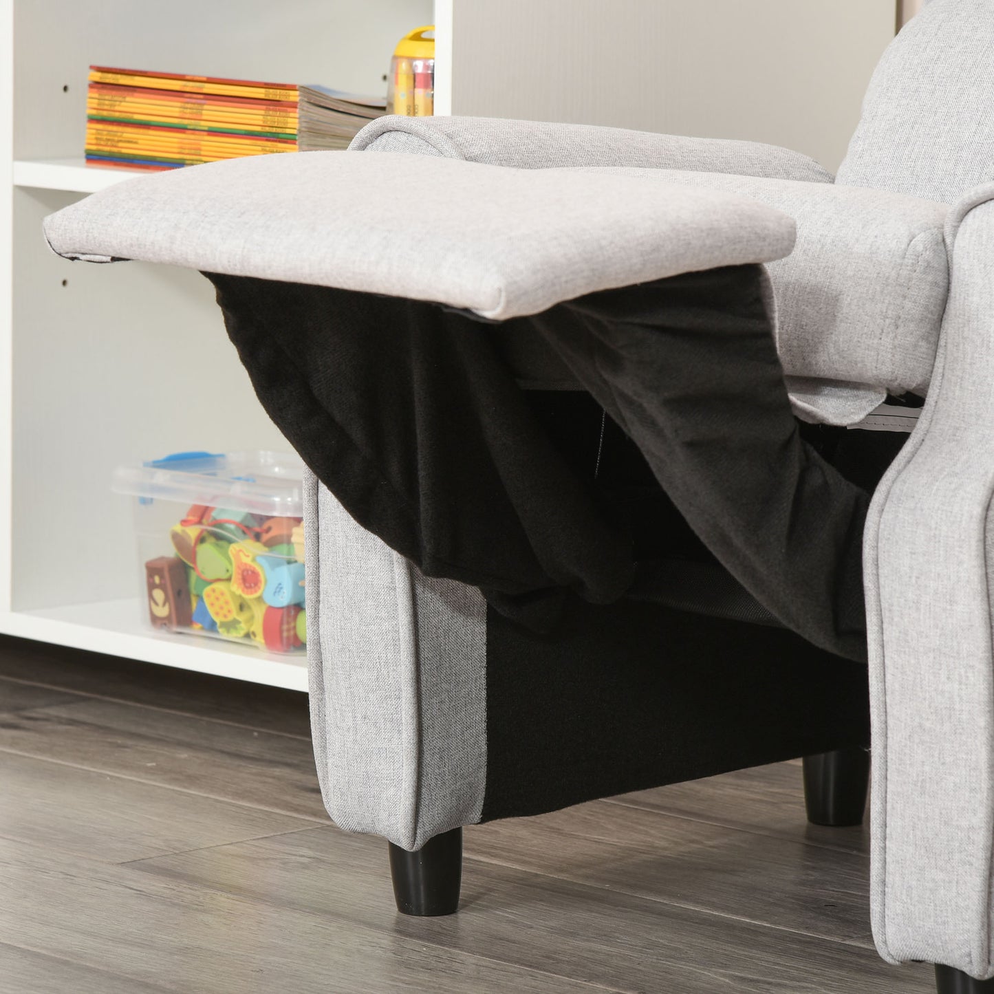 Light gray fabric recliner showing its extended footrest and black underside