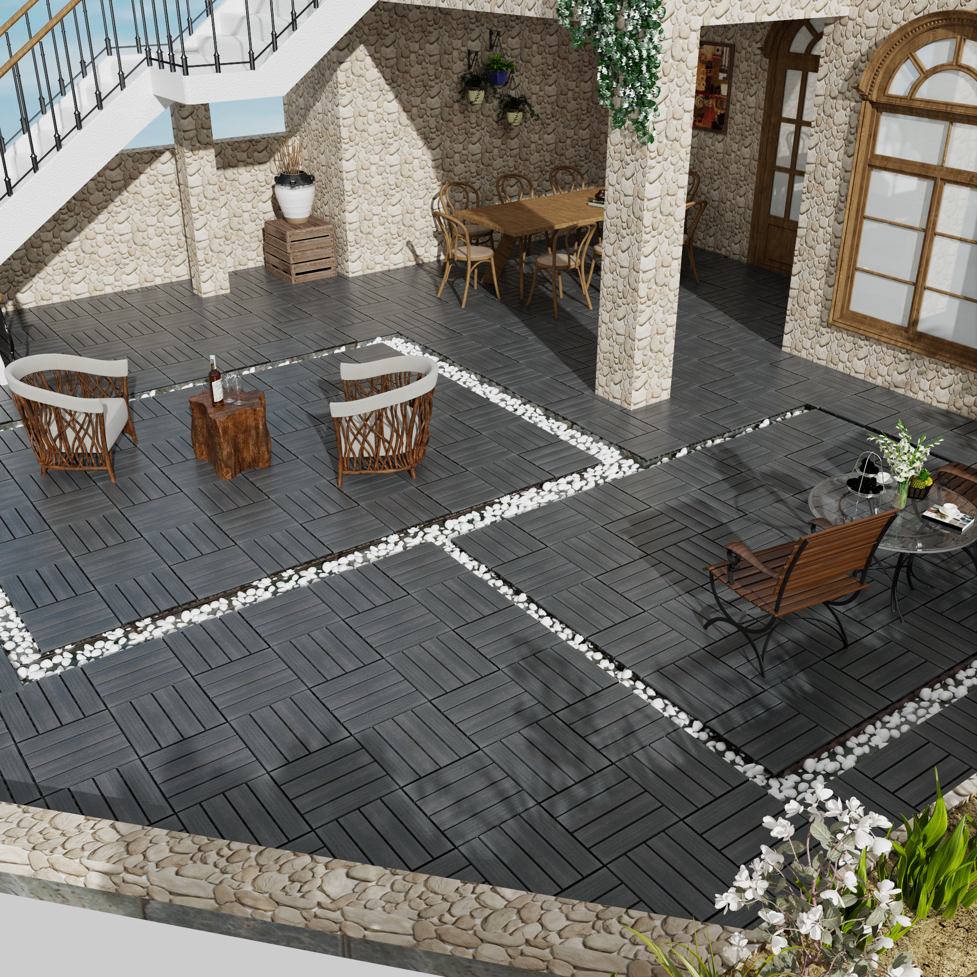 Dark grey composite deck tiles installed in a herringbone pattern creating a modern patio floor
