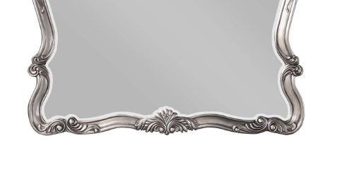 Ornate silver baroque mirror with carved scrollwork frame