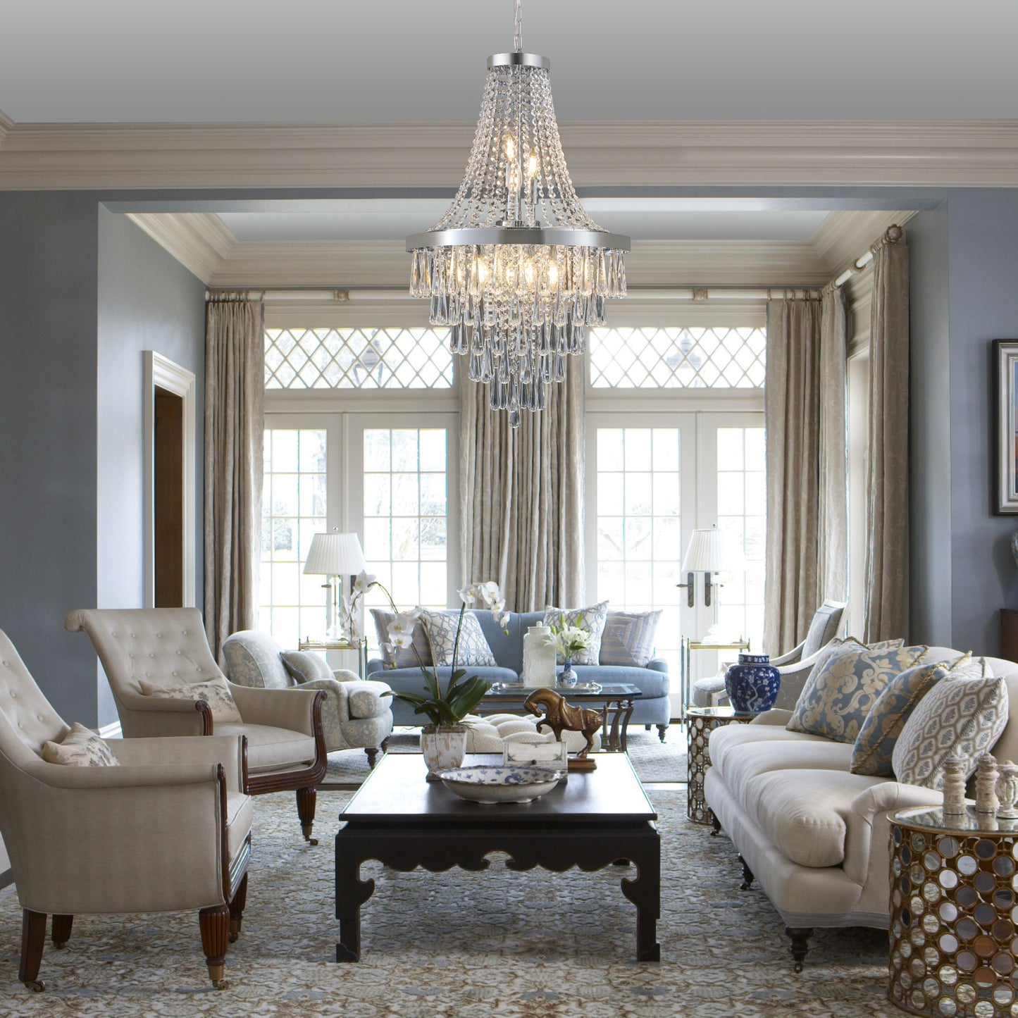 Elegant crystal chandelier with chrome finish cascading teardrop prisms for luxurious room lighting