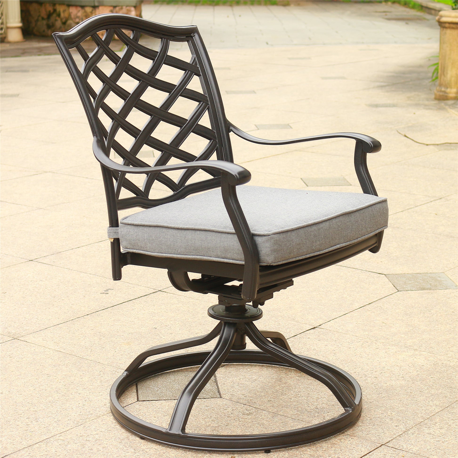 Black metal swivel patio chair with grey cushion and lattice back