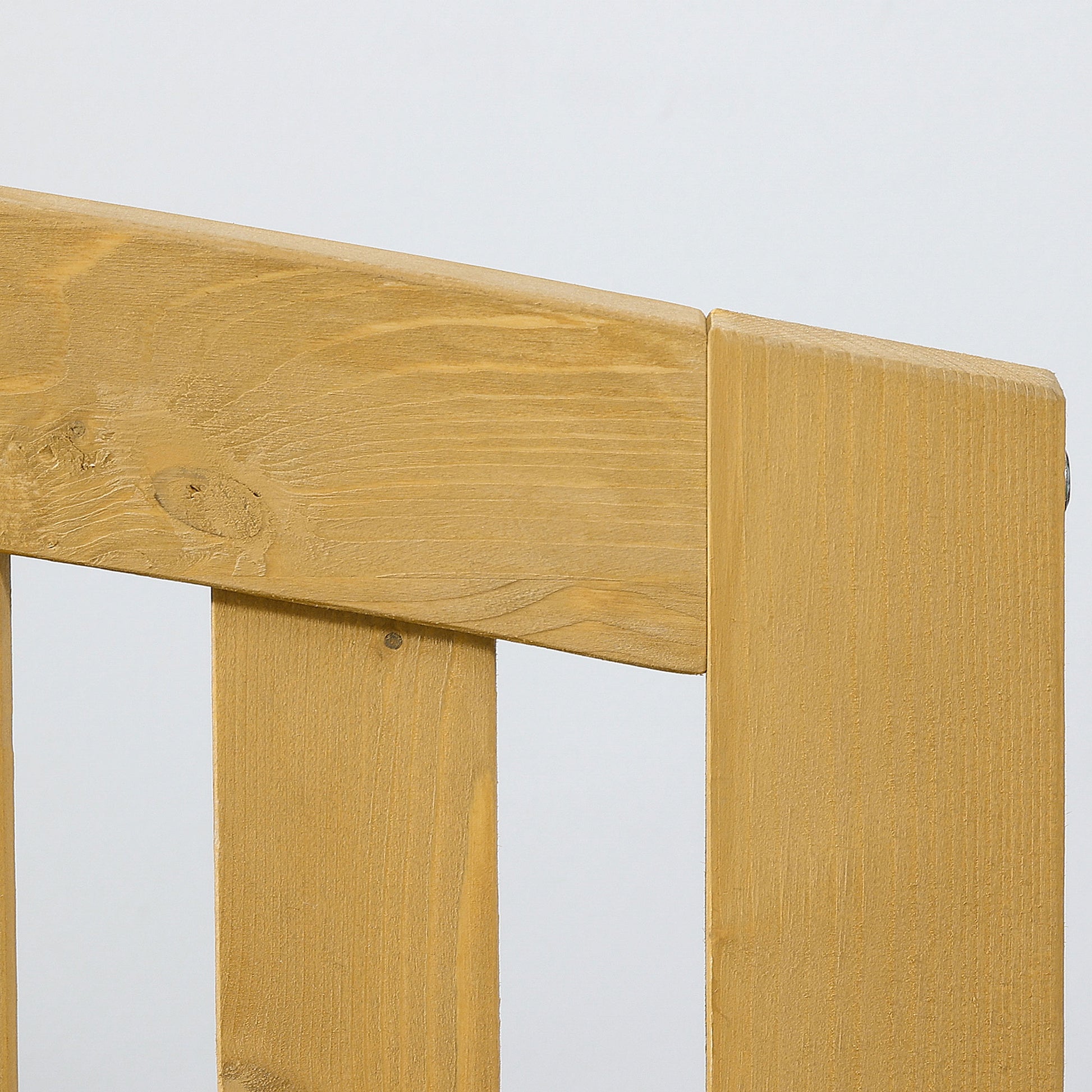Closeup of a golden oak wood bench with visible grain perfect for outdoor seating