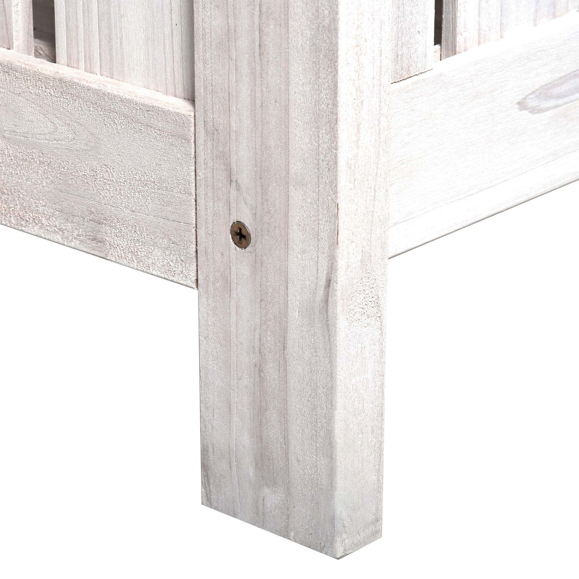 Whitewashed wood bench corner detail with visible grain and screw