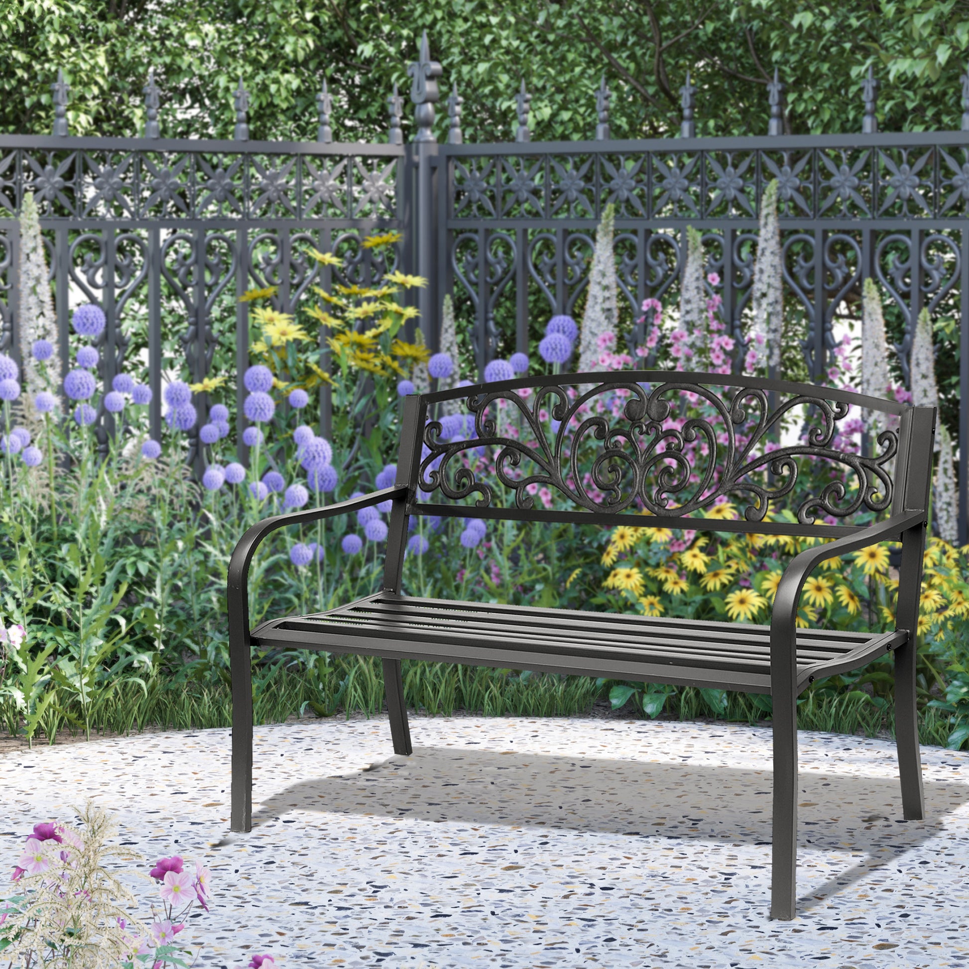 Dark gray metal garden bench with ornate scrollwork backrest