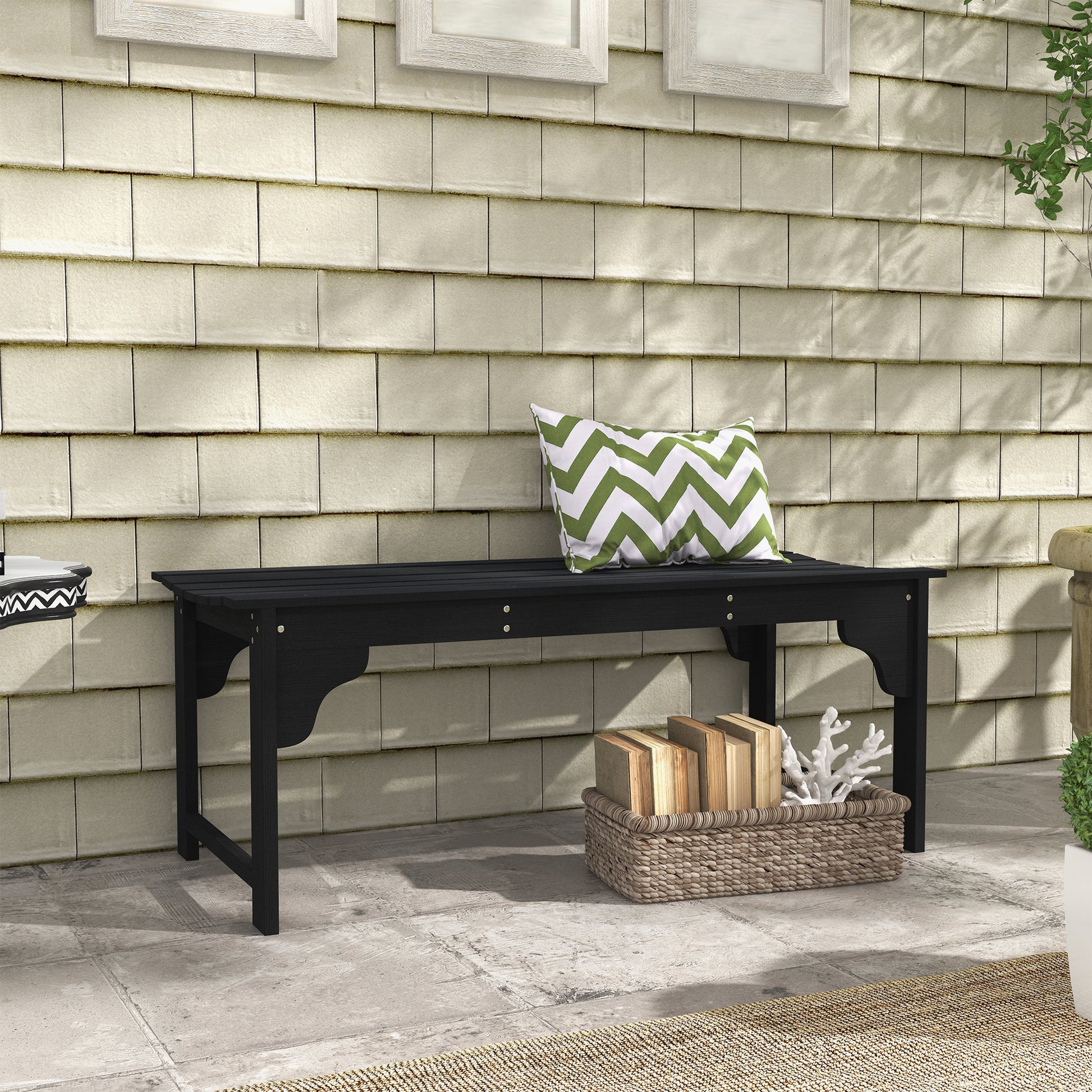 Black slatted outdoor bench with curved legs suitable for patio decor