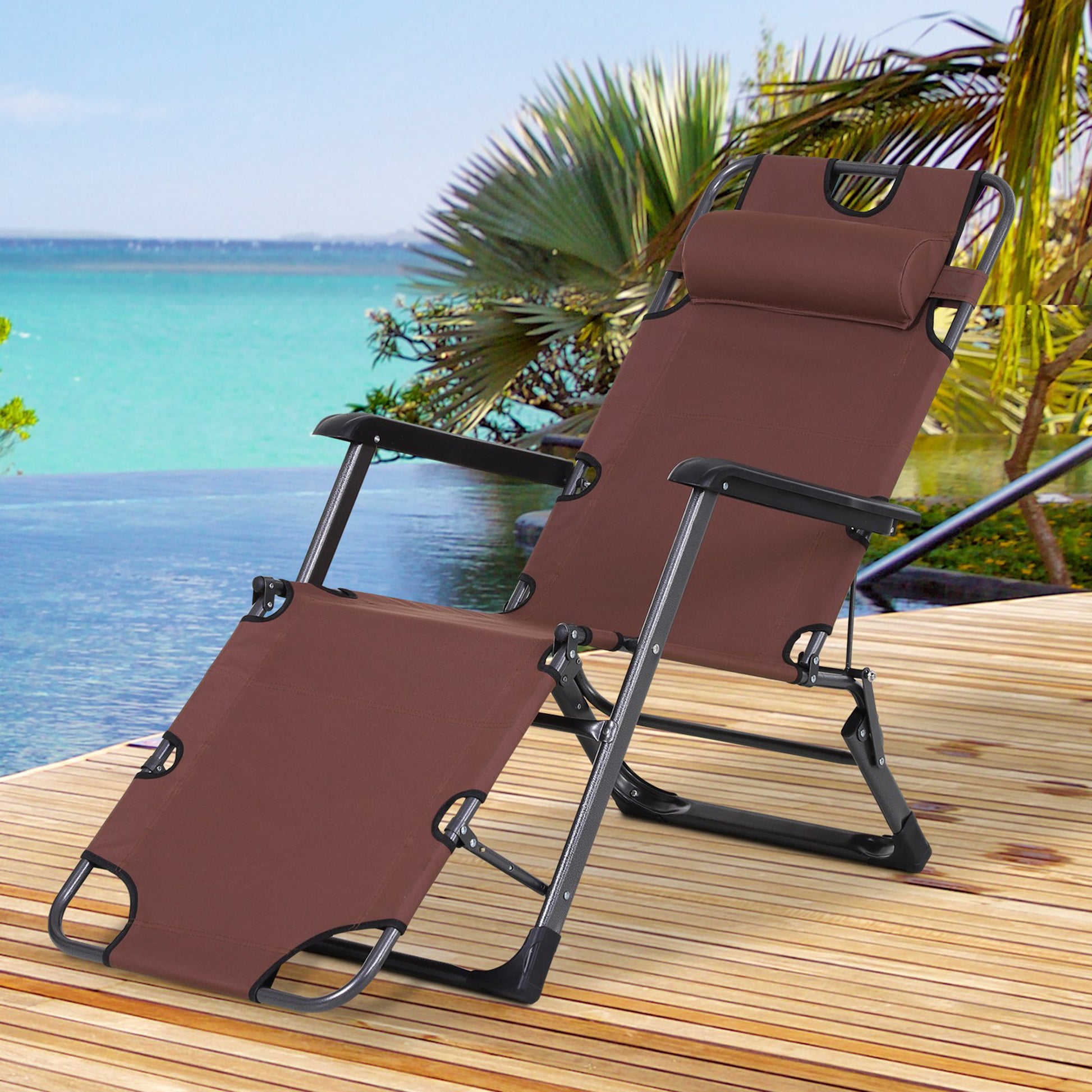 Brown reclining zero gravity chair with pillow and armrests on wooden deck by pool
