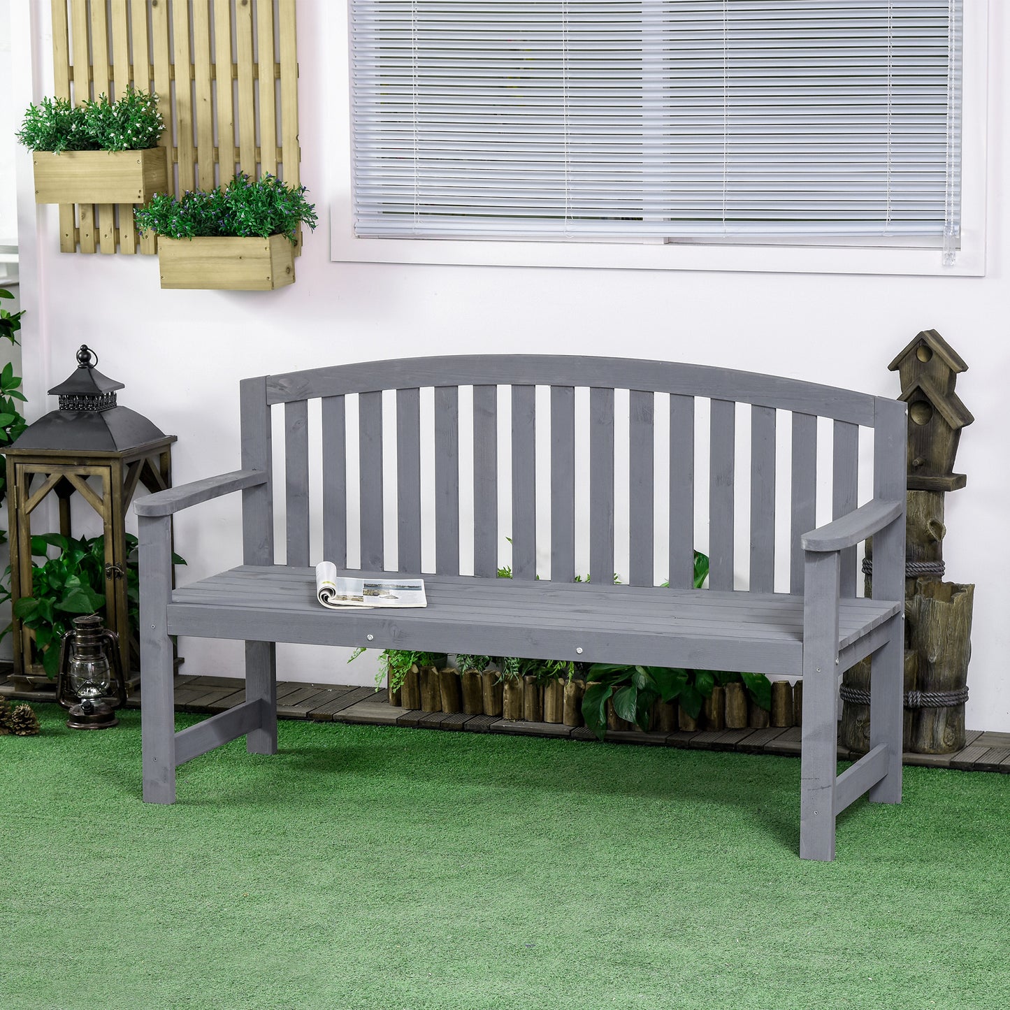 Grey wooden garden bench with slatted back and seat ideal for outdoor relaxation