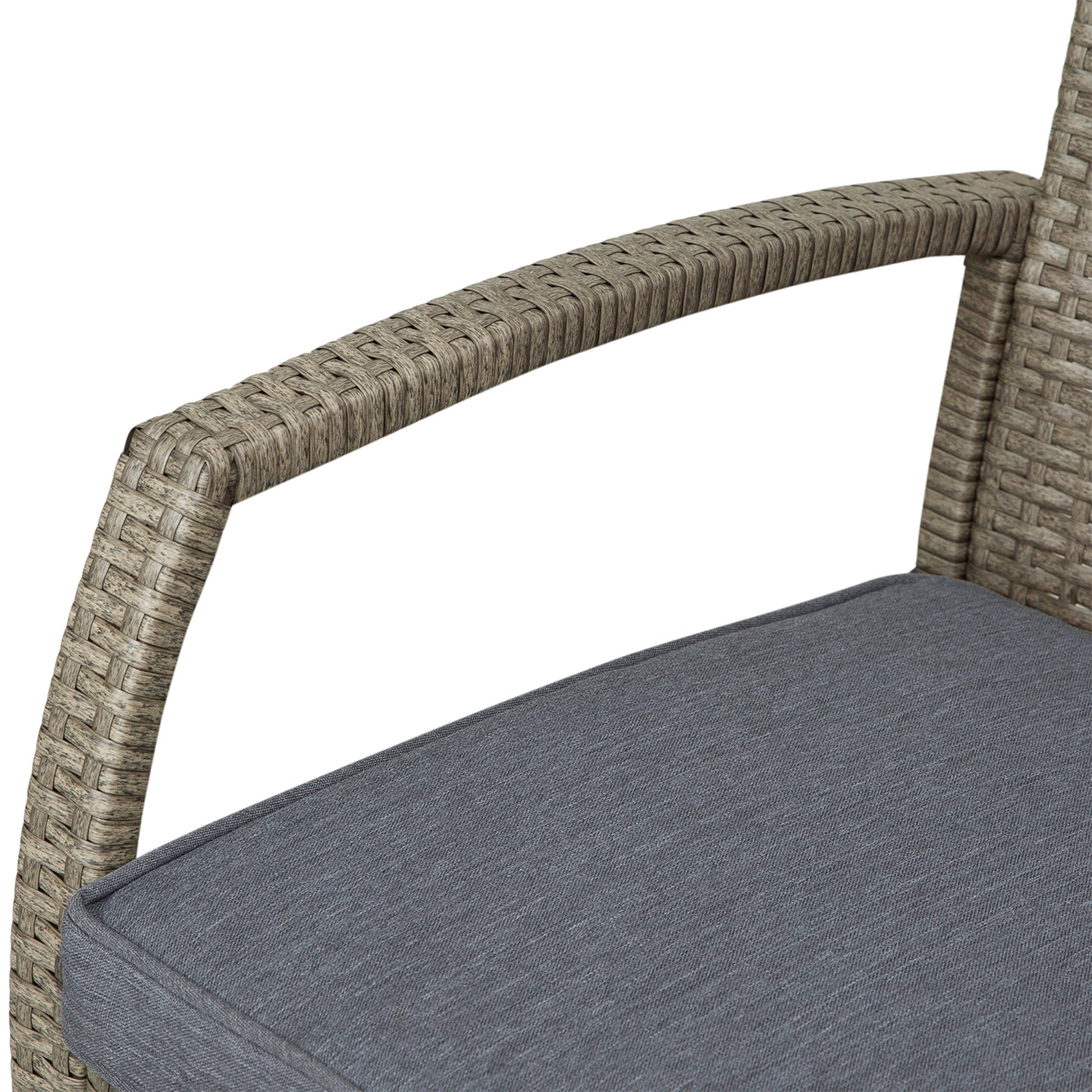 Close up of grey wicker chair arm with textured fabric cushion