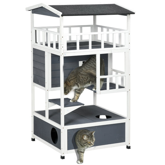 Threetiered white and grey wooden cat condo with two cats exploring different levels