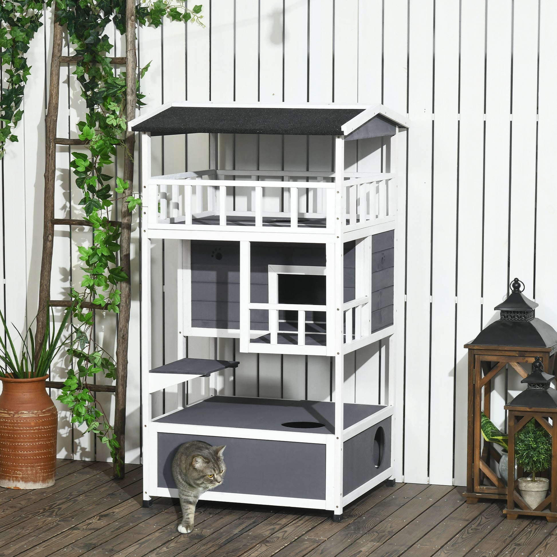 Gray and white multilevel cat condo with platforms and enclosed cubbies perfect for indoor cats