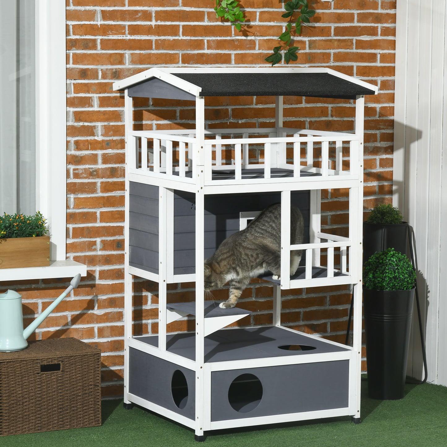 Multilevel white and gray wooden cat tree with enclosed hideaways and platforms