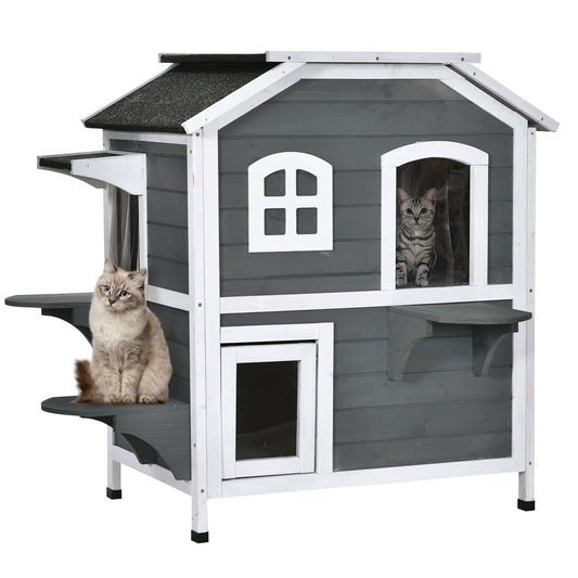 Gray and white wooden cat house with two cats enjoying outdoor living