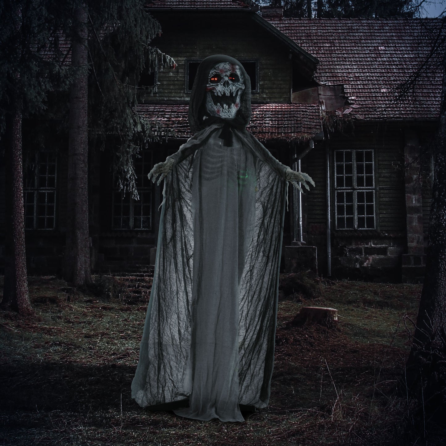 Scary grim reaper Halloween decoration with glowing red eyes and tattered black cloak