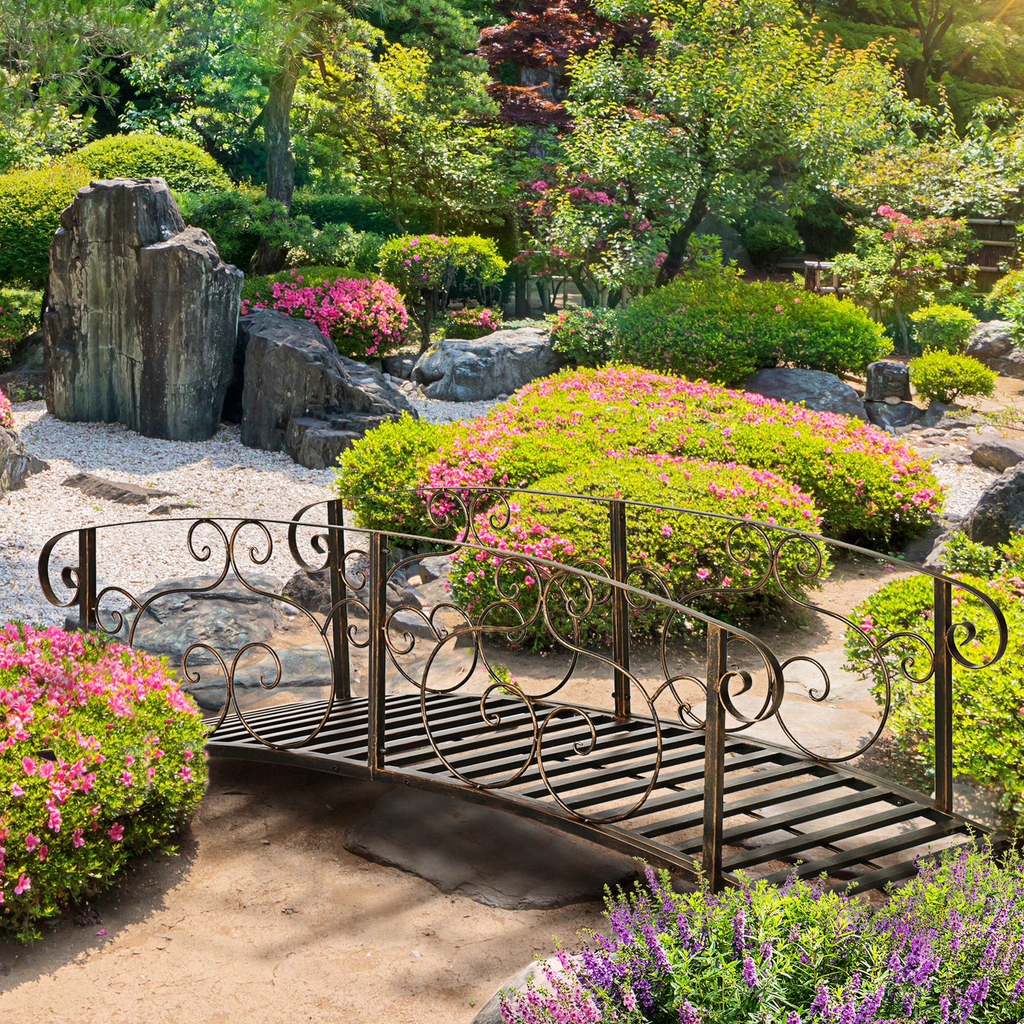 Decorative metal garden bridge with ornate scrollwork suitable for ponds or streams