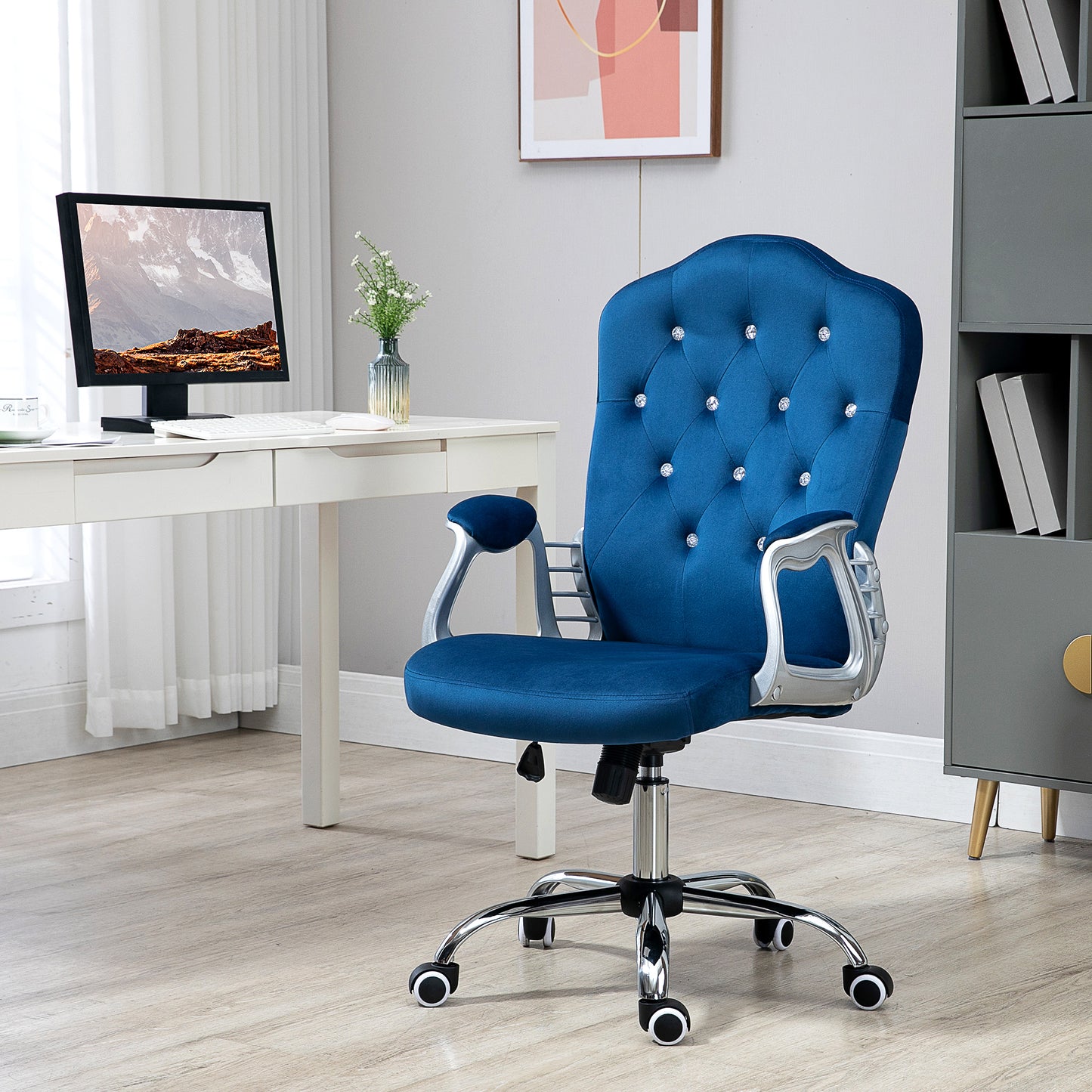 Tufted blue velvet office chair with crystal accents silver arms and wheeled base