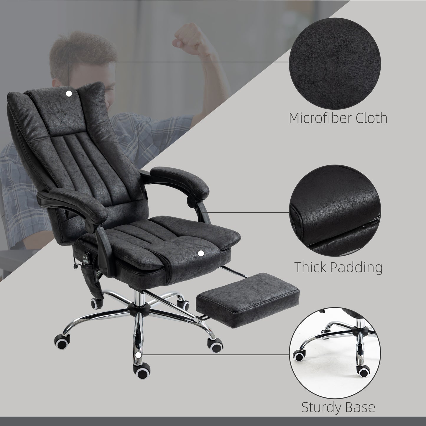 Black executive office chair with microfiber cloth upholstery and retractable footrest