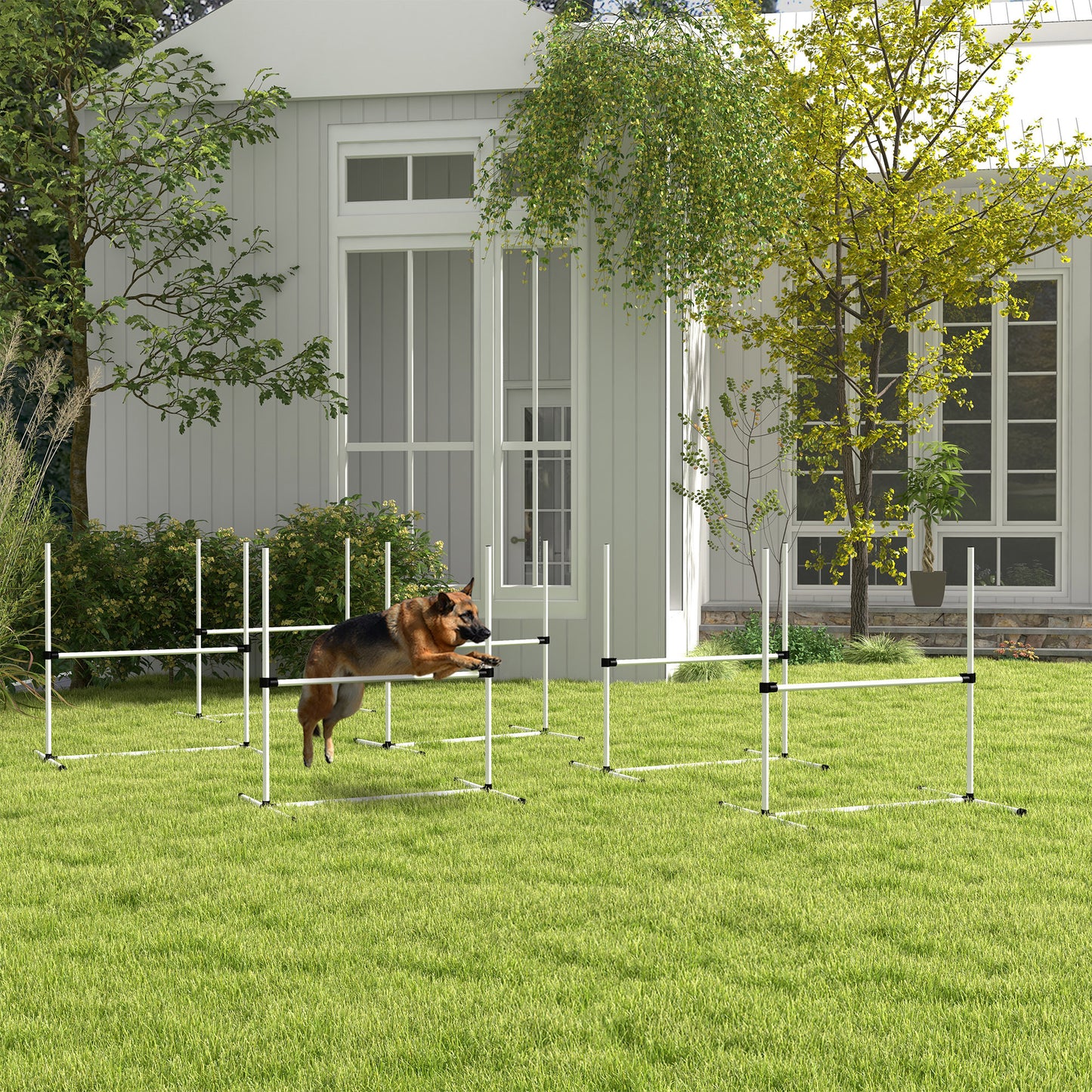 German Shepherd jumping over agility hurdle in backyard training setup