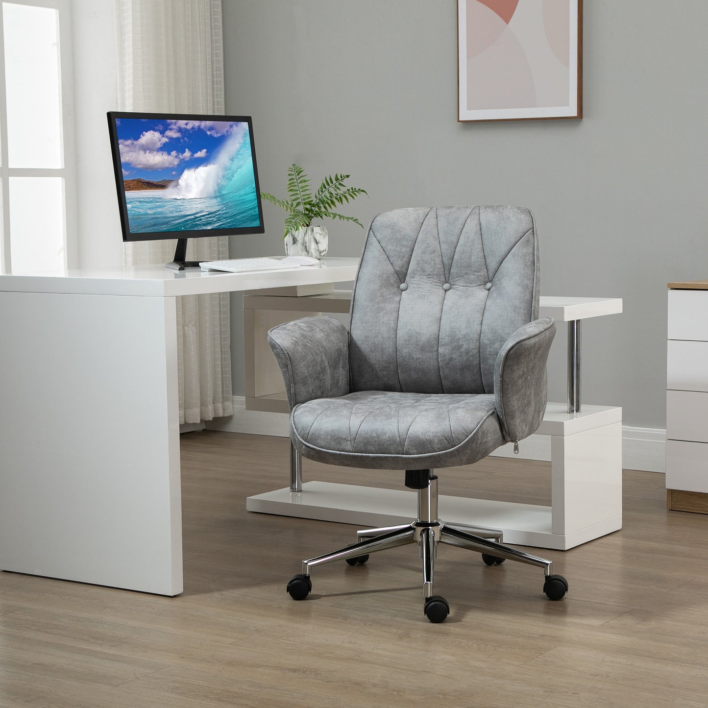 Tufted gray faux leather office chair with chrome base and wheels for home office