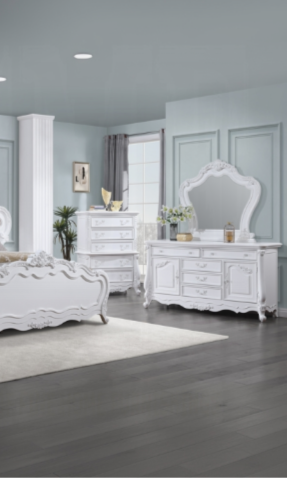 White ornate dresser with multiple drawers and detailed carvings