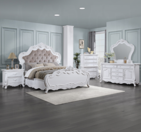 White tufted upholstered headboard bed with ornate carved details and matching nightstand