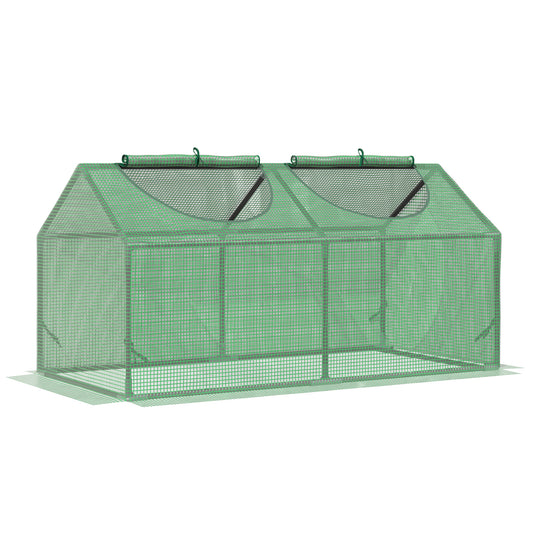 Green mini greenhouse with rollup windows and mesh cover for garden plants