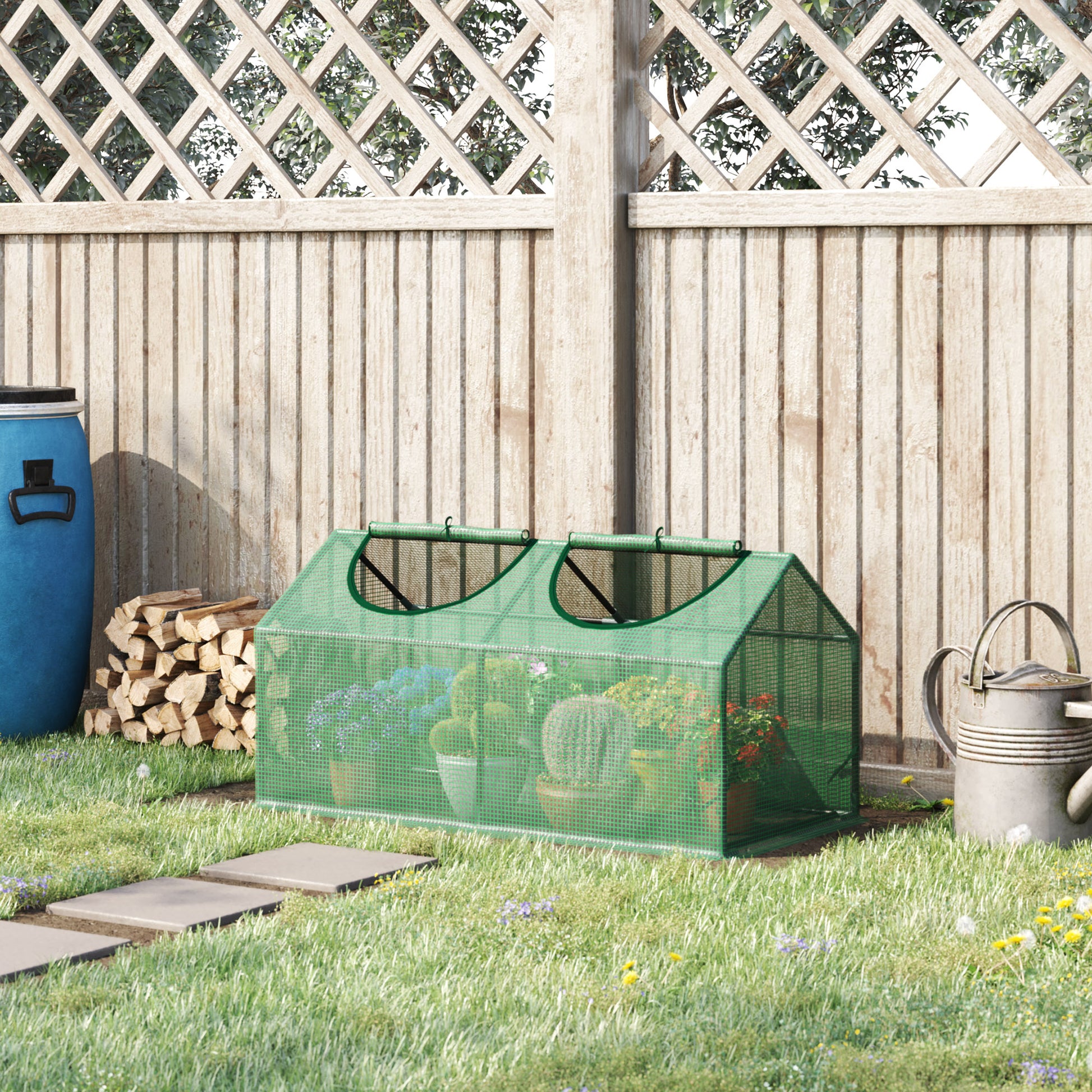 Green mini greenhouse with two rollup doors housing various potted plants