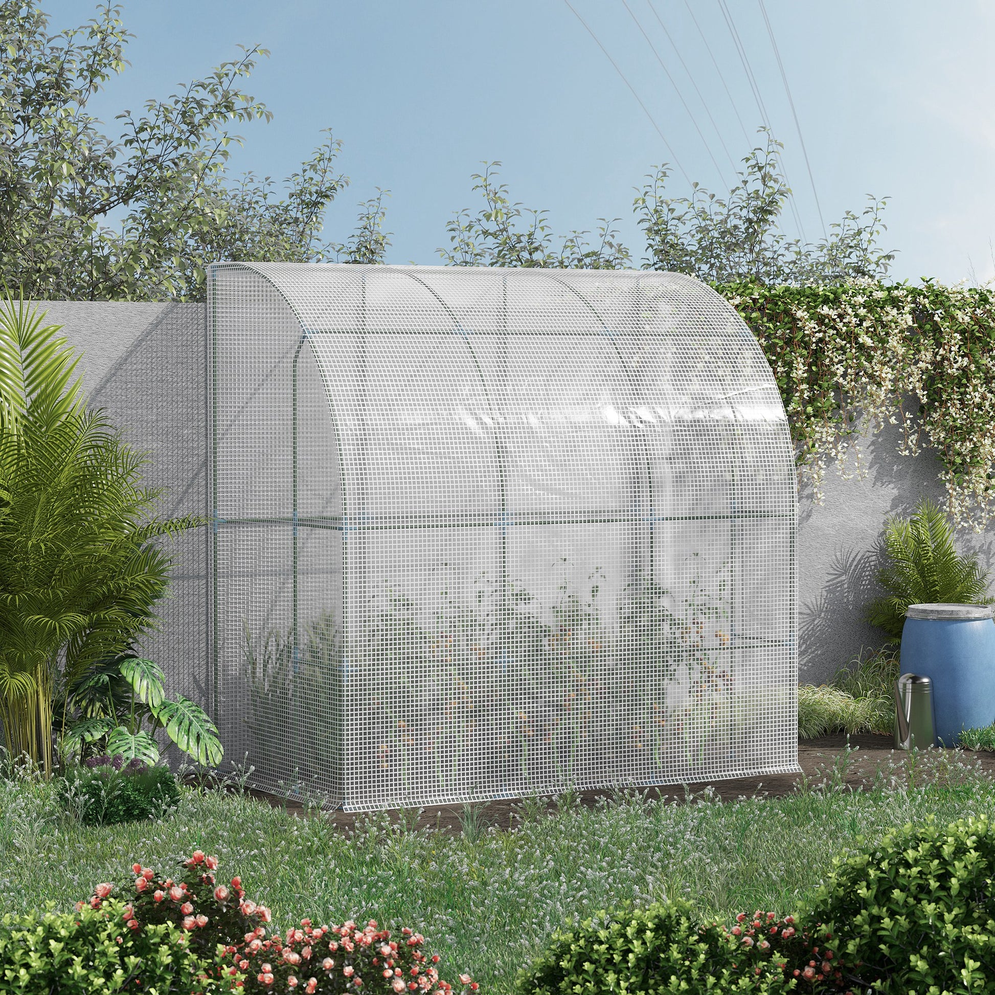 Compact white mesh greenhouse protecting plants in a lush garden