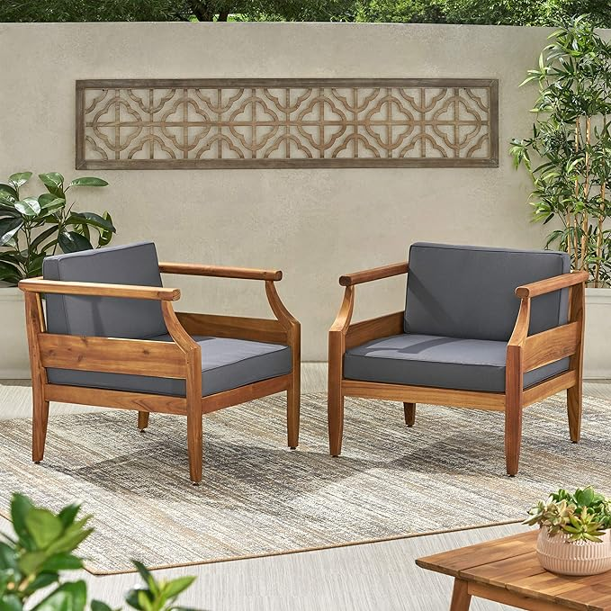 Two modern wooden outdoor chairs with grey cushions ideal for patio seating