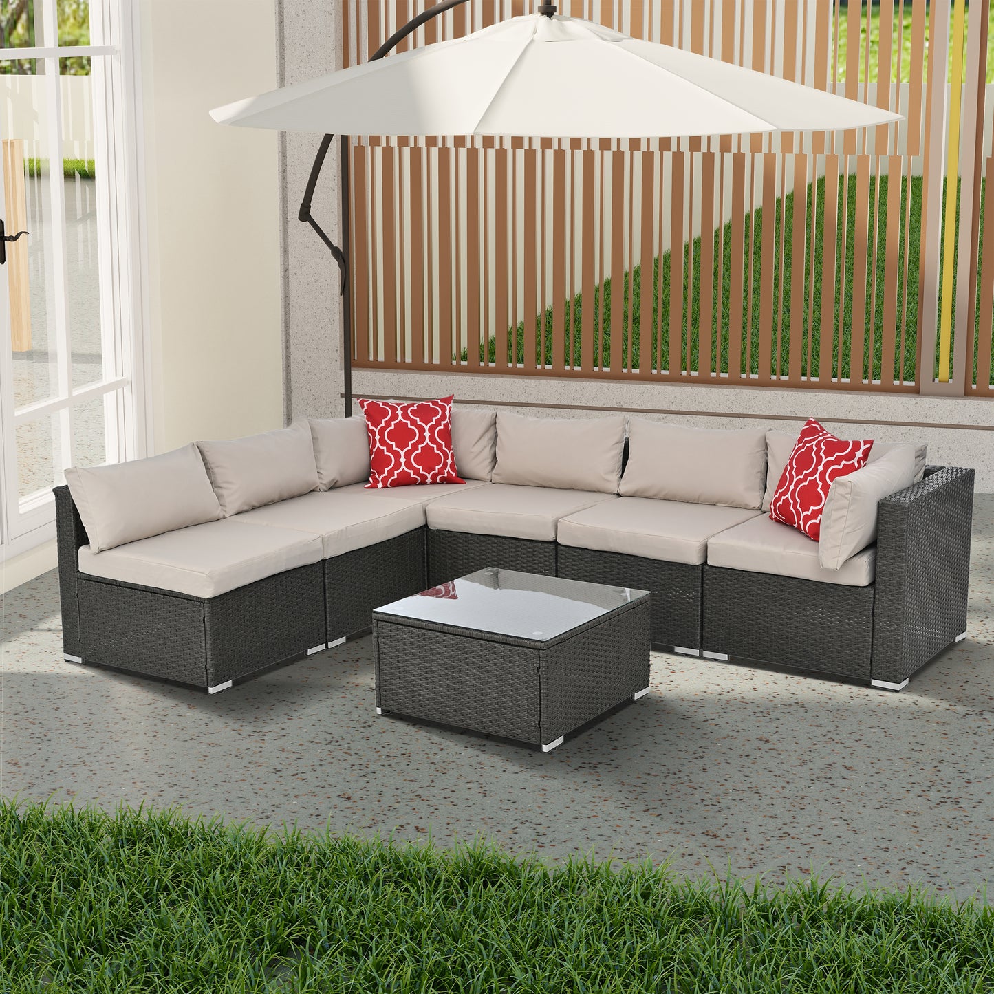 Dark grey wicker sectional patio sofa with beige cushions and red patterned pillows