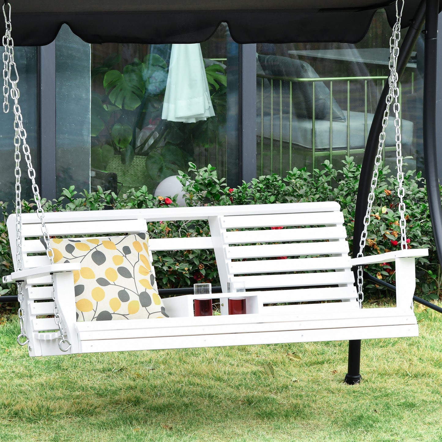 White wooden garden swing with yellow and gray leaf pattern cushion outdoor relaxation