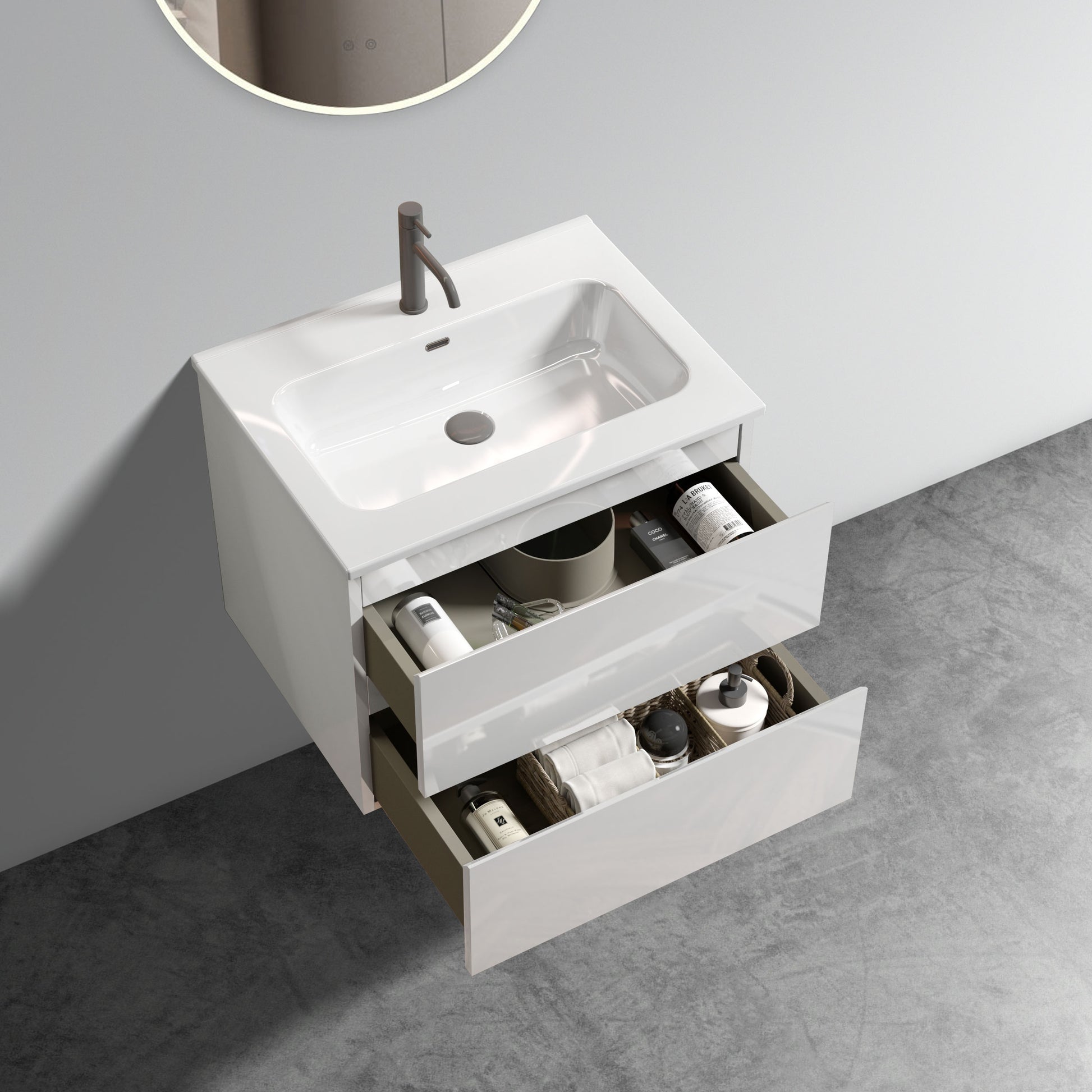 White wallmounted vanity with an open drawer revealing toiletries and towels