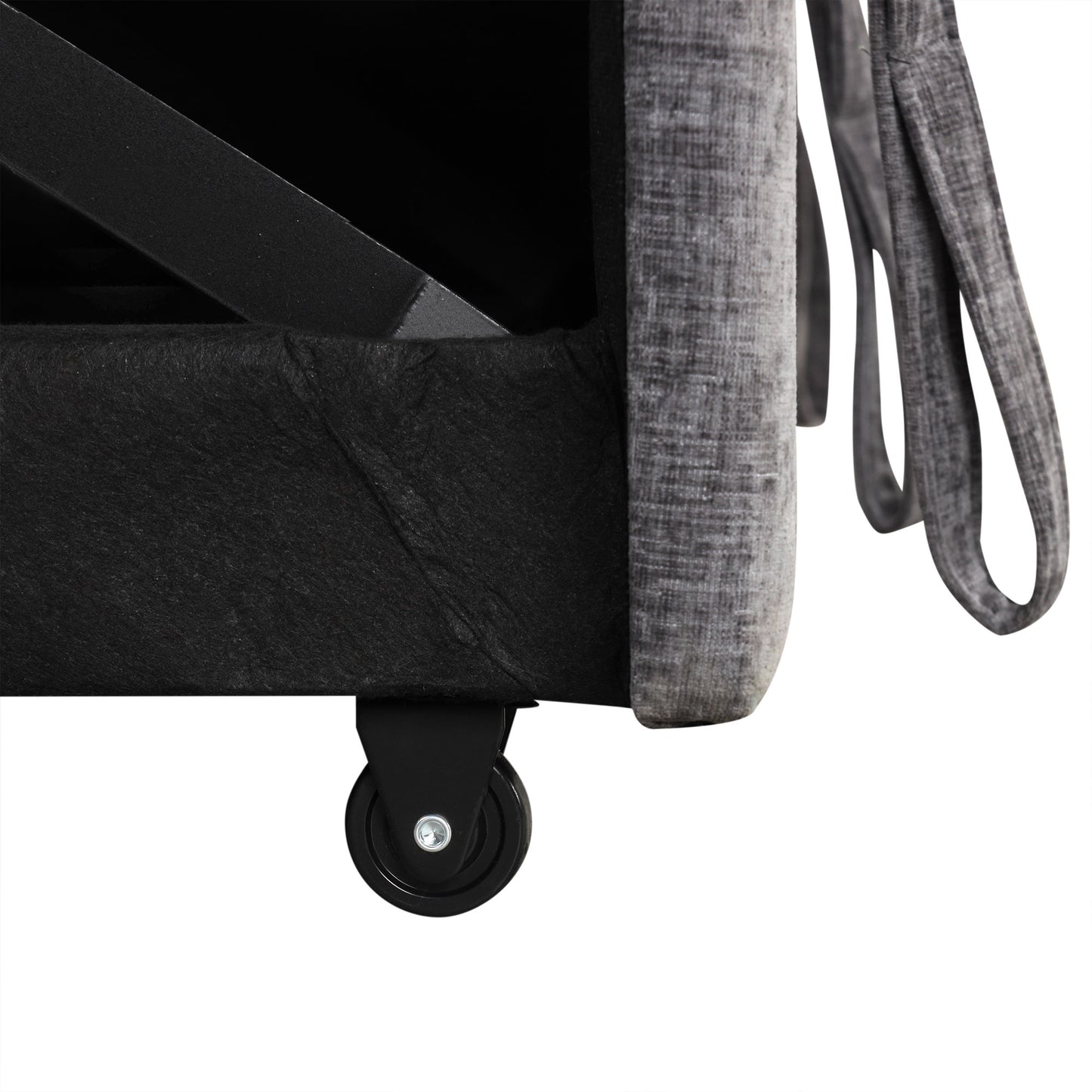 Grey upholstered storage ottoman with black caster wheels and metal frame support