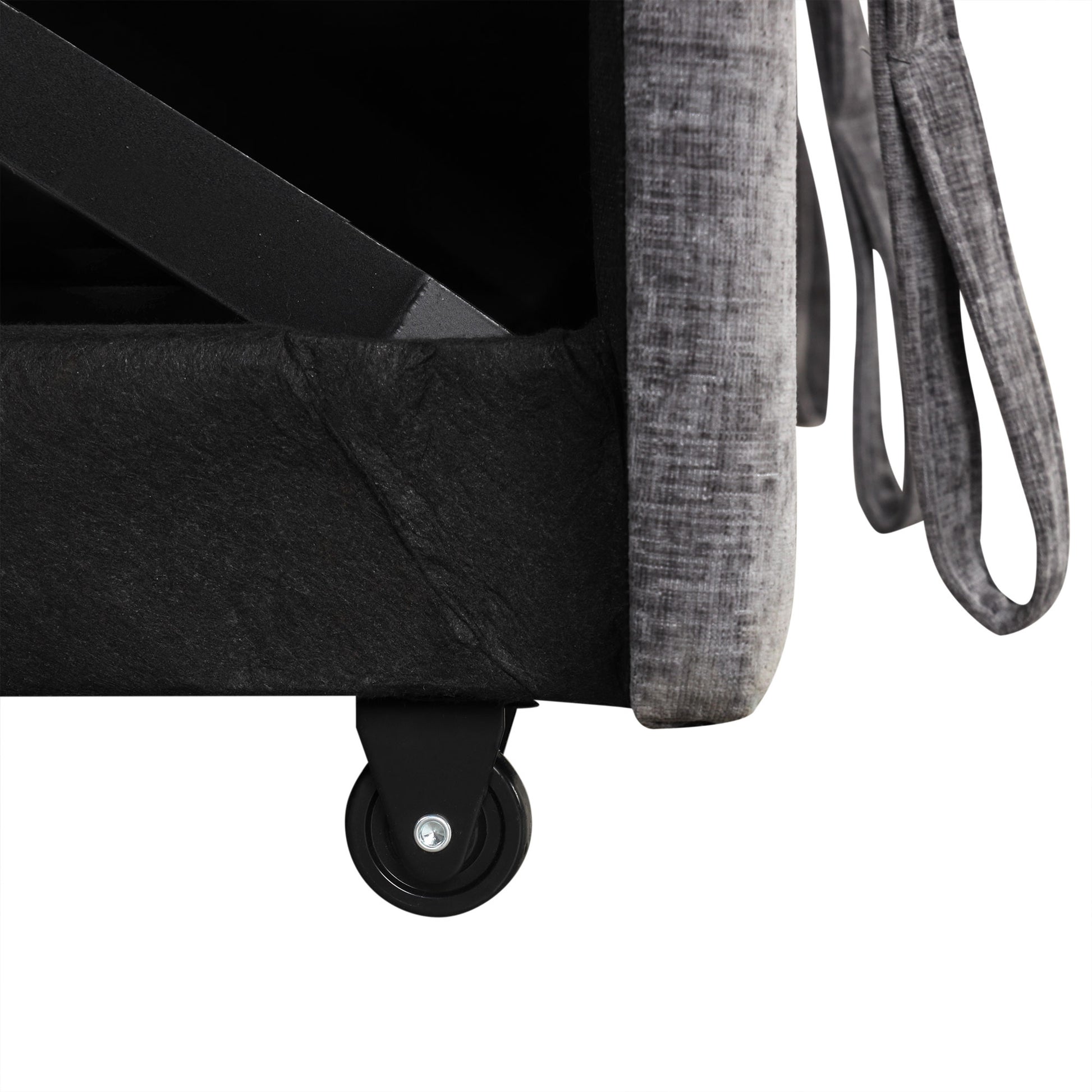 Grey upholstered storage ottoman with black caster wheels and metal frame support