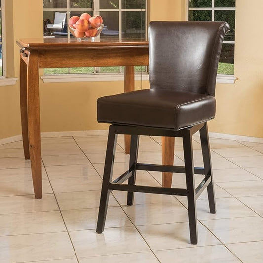 Brown swivel bar stool with dark wood legs and padded faux leather seat