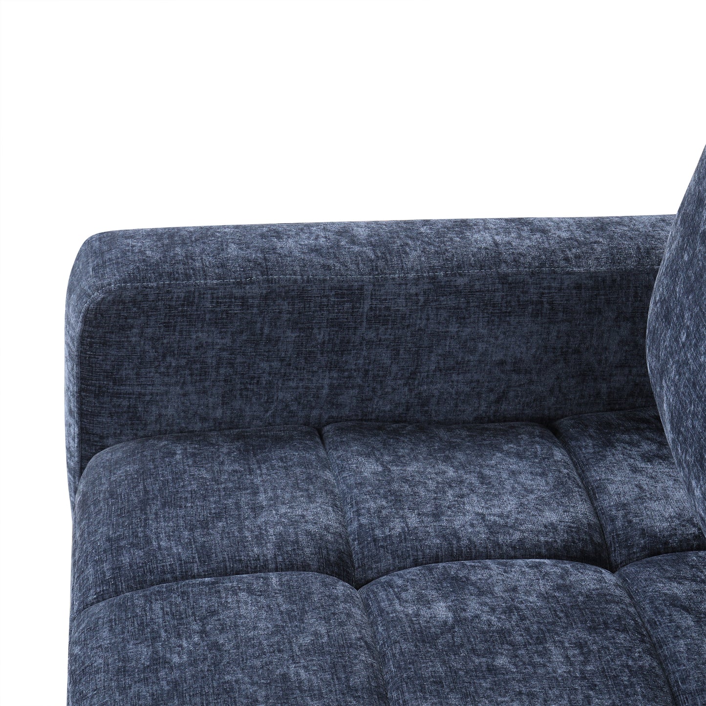 Closeup of navy blue tufted fabric sofa armrest and seat cushion with textured weave