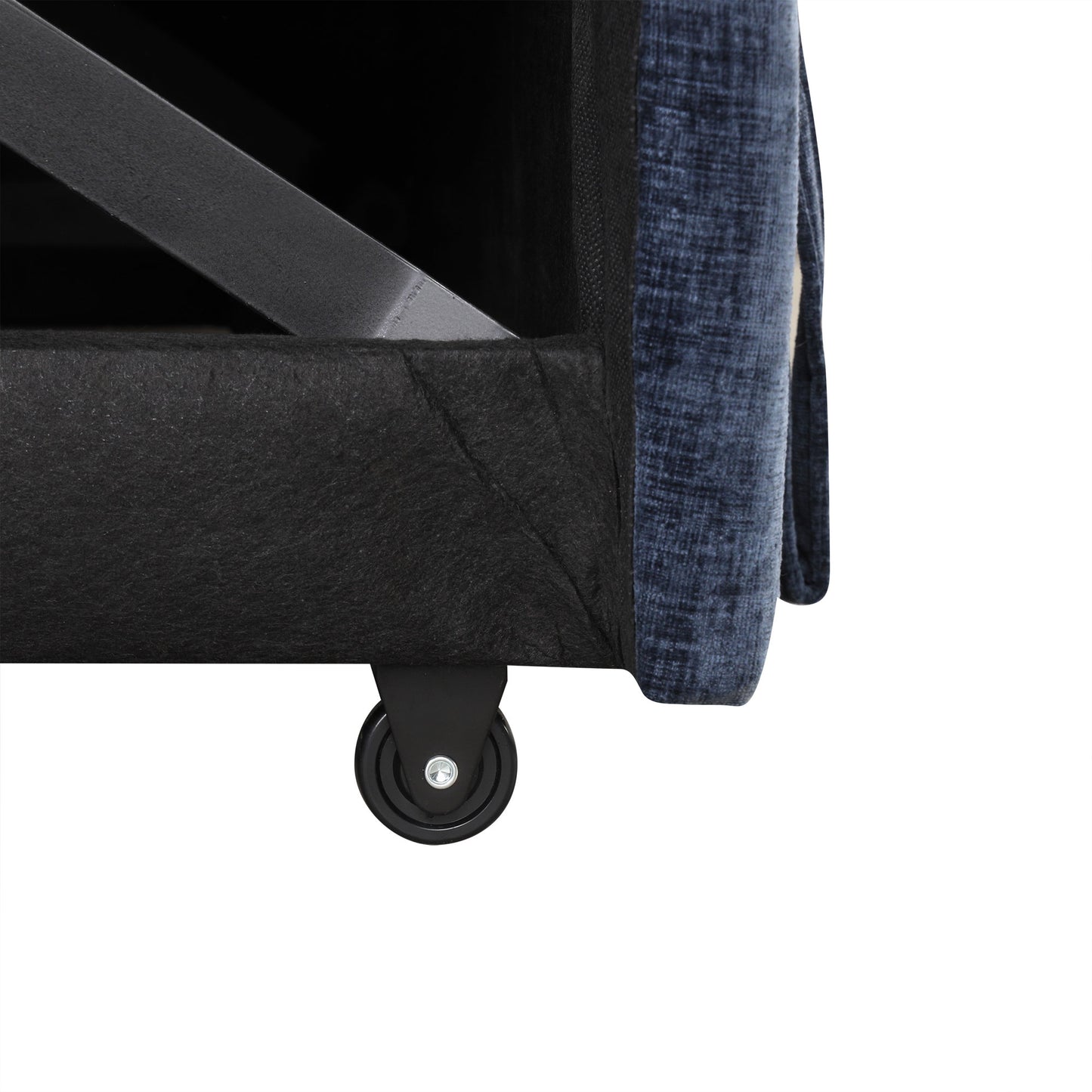 Closeup of a blue textured fabric sofa armrest with a black caster wheel below
