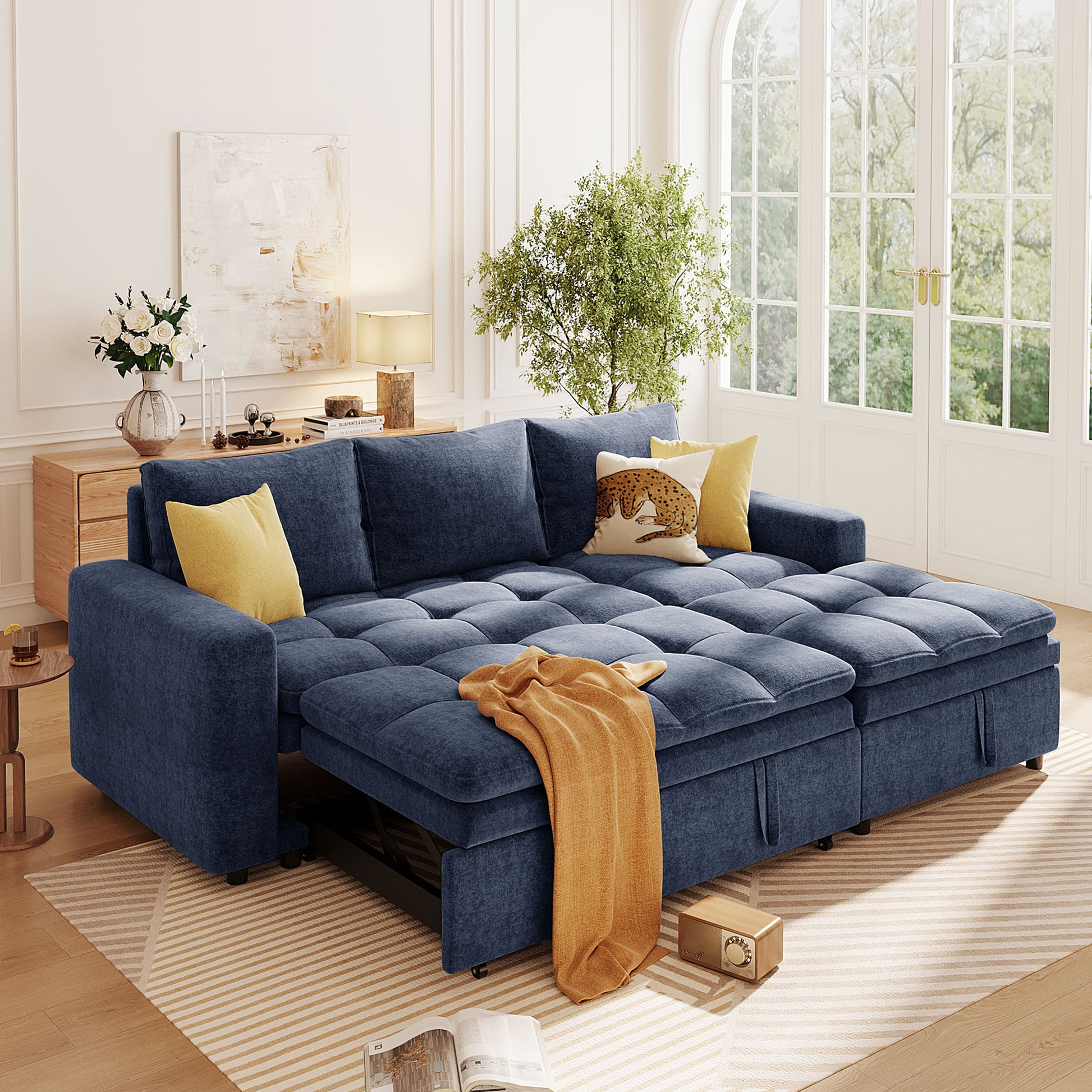 Deep blue sectional sofa with tufted cushions and orange throw featuring hidden storage