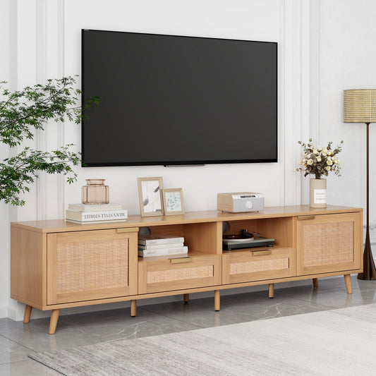 Light oak media console with rattan accents and gold drawer pulls supporting a large TV