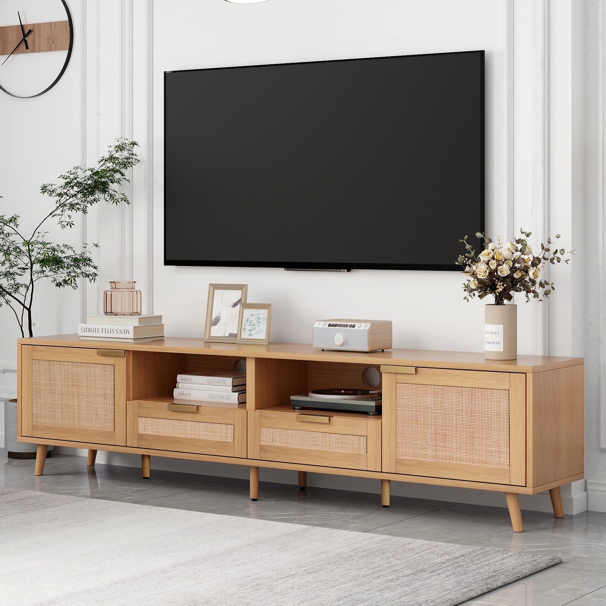 Modern light oak TV stand with woven cane cabinet doors and gold handles
