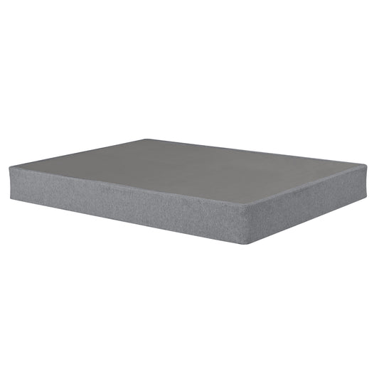 Grey fabric covered box spring foundation for a mattress