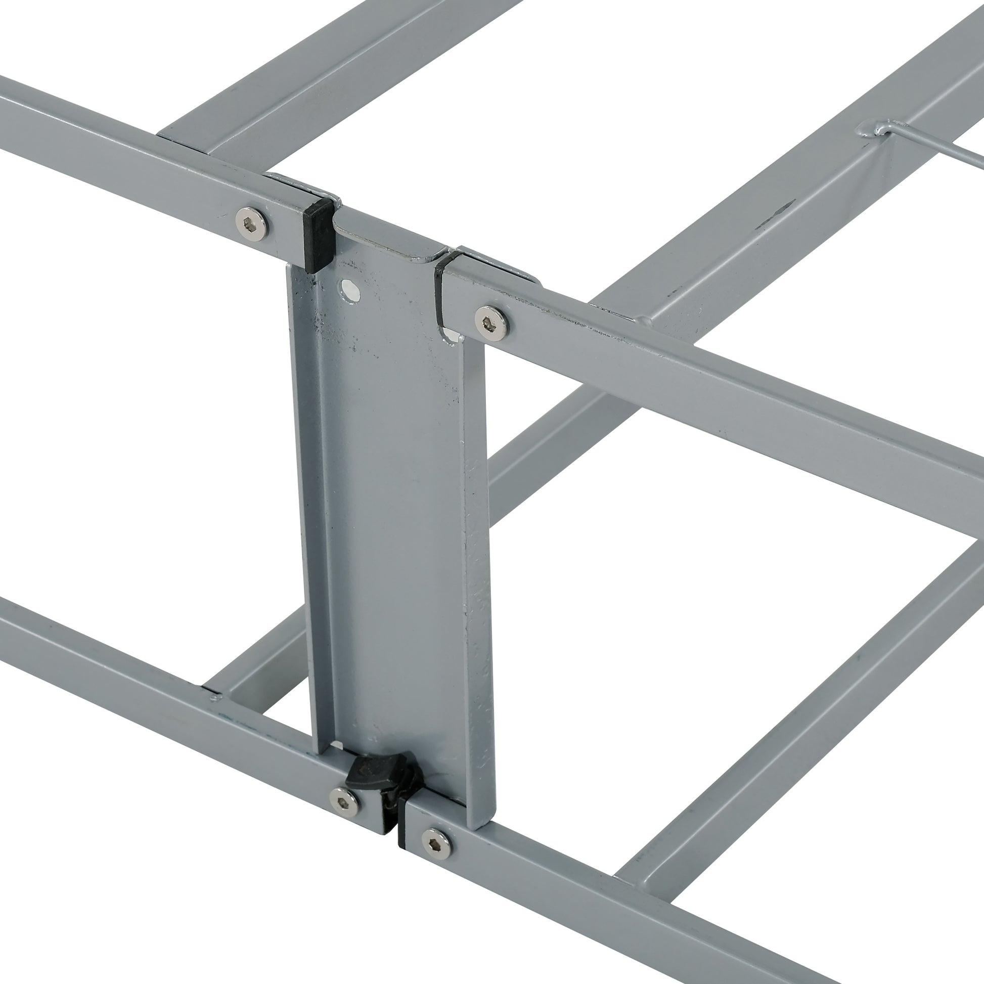 Closeup of a silver metal bed frame with bolted joint