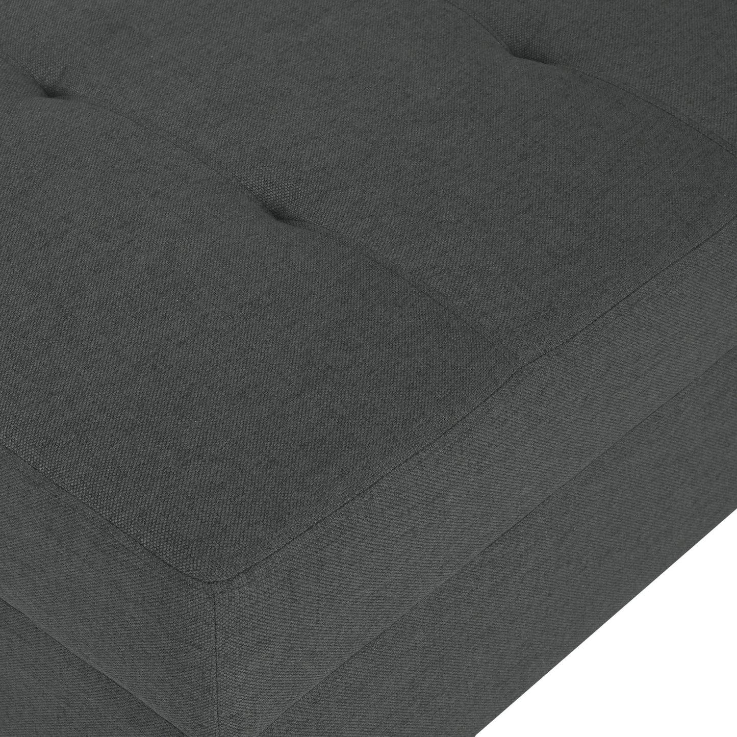 Closeup of charcoal grey tufted ottoman fabric texture with visible stitching details