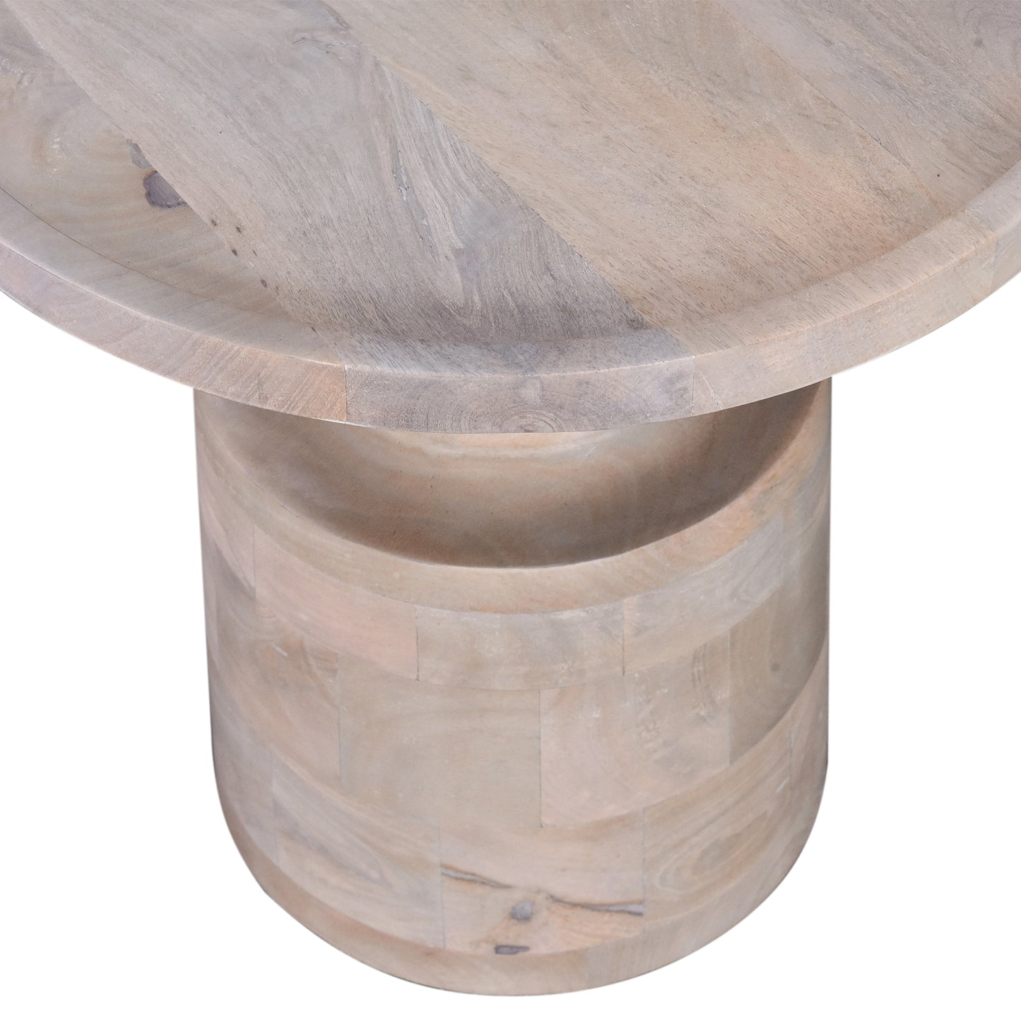 Closeup of a round wooden coffee table with a textured light grey finish