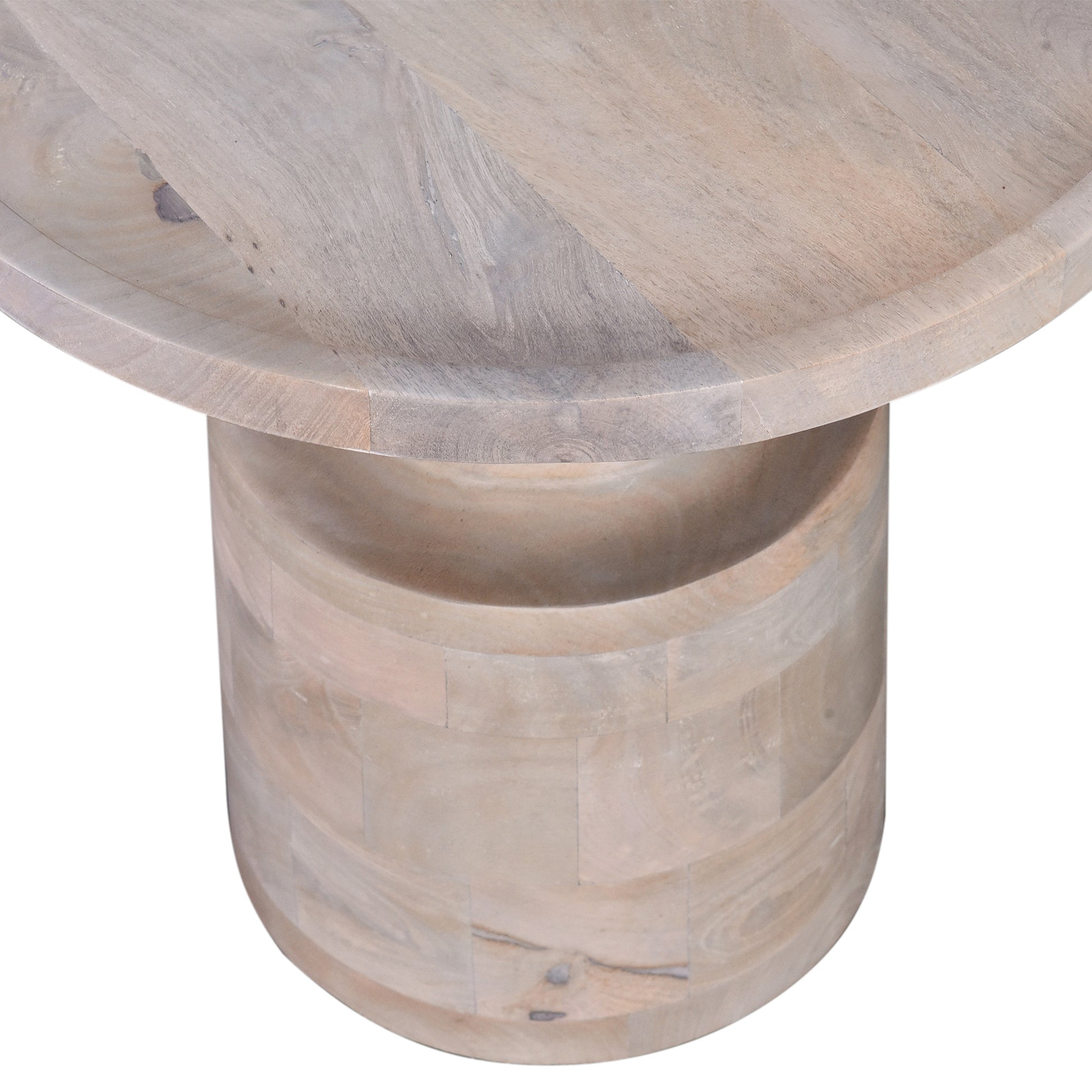 Closeup of a round wooden coffee table with a textured light grey finish