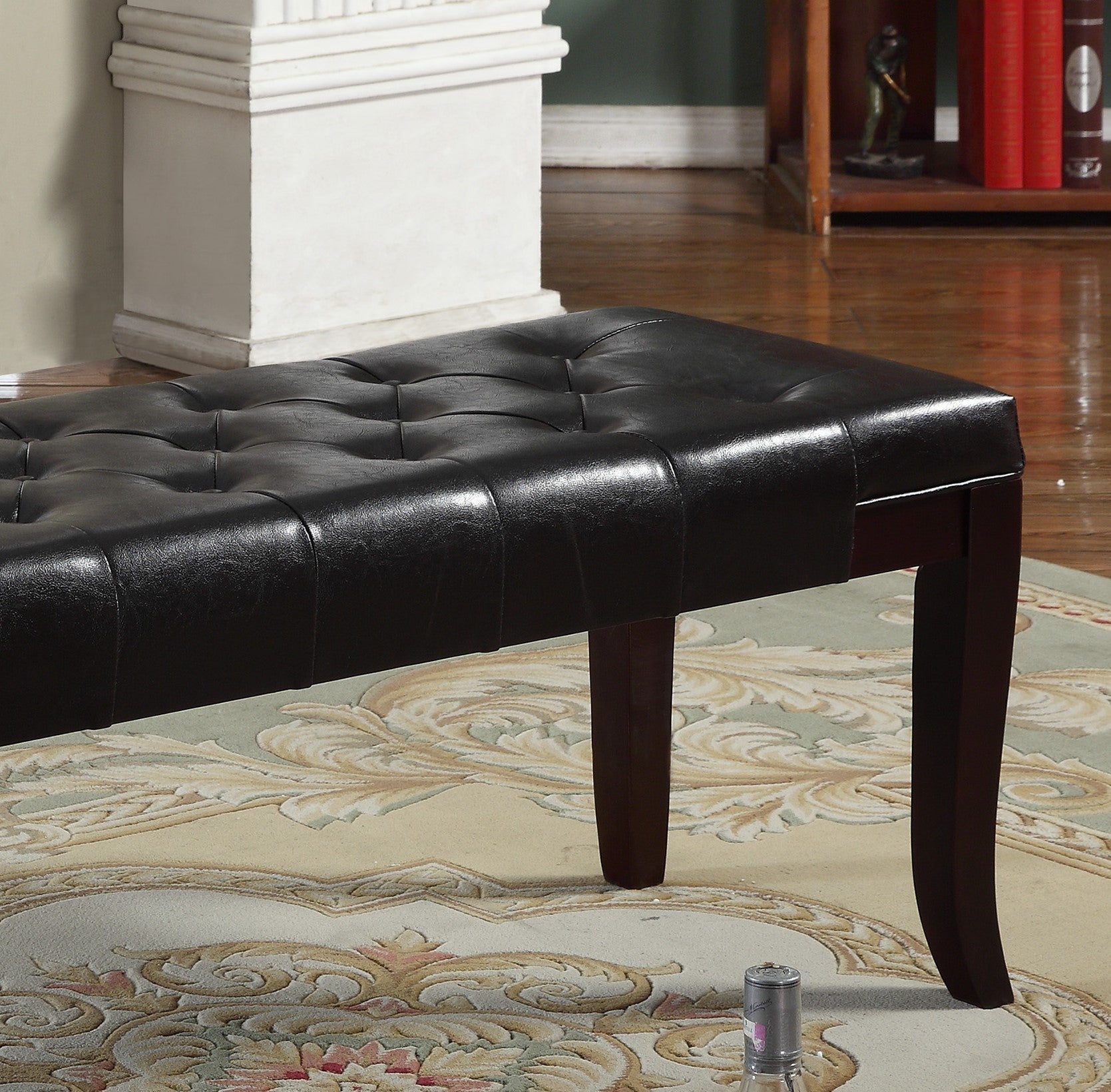 Dark brown tufted faux leather bench with wooden legs