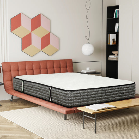 Queen size mattress with white quilted top and gray patterned sides on a contemporary bed frame
