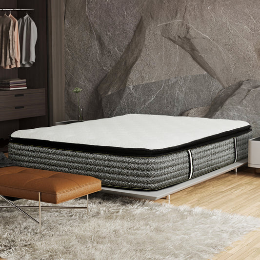 Plush pillow top mattress with a black and silver damask pattern fabric border